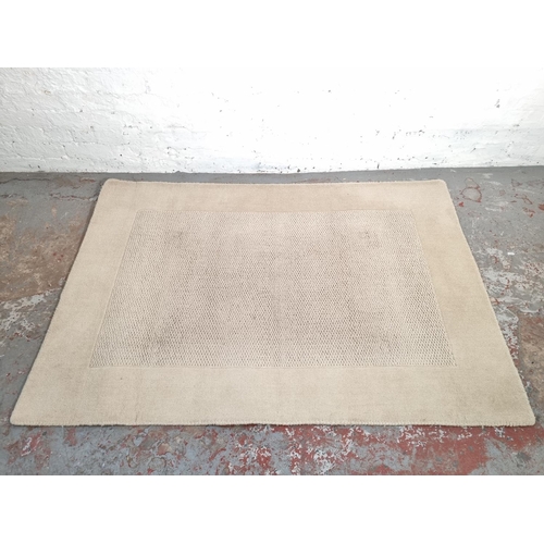 1180C - A Next cream rug - approx. 170cm x 119cm