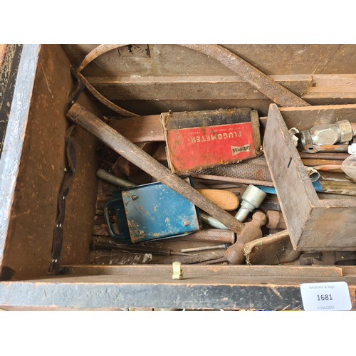 1681 - An early/mid 20th century ebonized pine tools chest containing vintage files, hammers, spanners etc.