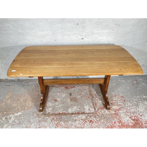 1178A - An Ercol elm and ash rectangular dining table - approx. 72cm high x 76cm wide x 153cm long