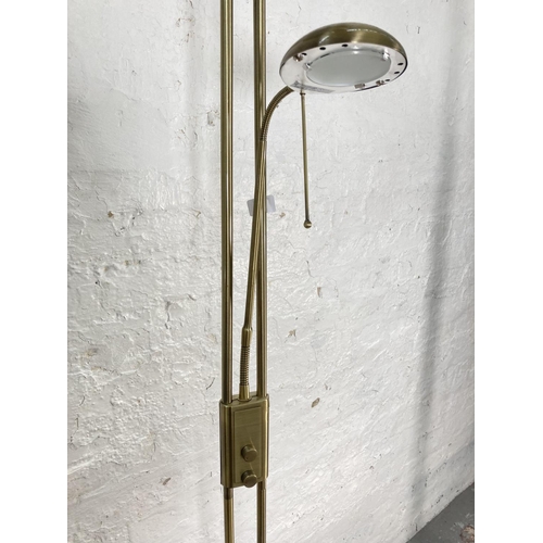 1178B - Two modern standard lamps, one brass effect - approx. 180cm high and one brushed steel effect with r... 