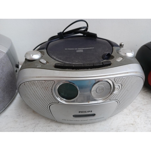 1302 - Four portable CD players, one Philips AZ1022 with radio and cassette, one Hitachi CX-430 with radio ... 