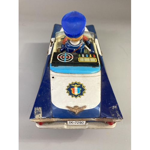 637 - A 1960's Japanese tinplate Highway Patrol battery operated toy car - approx. 13cm high x 10cm wide x... 