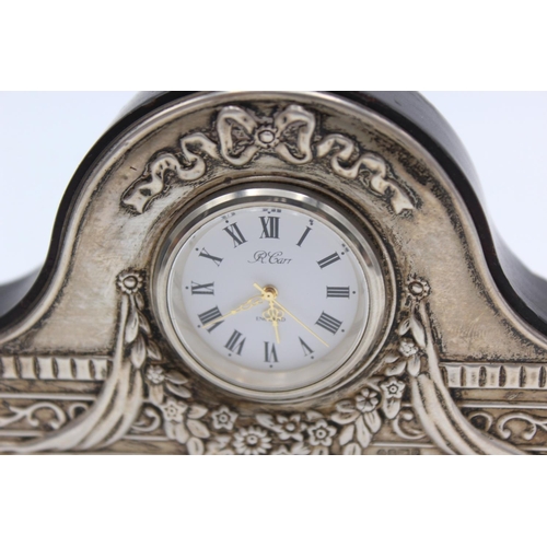 230 - An R. Carr hallmarked .925 silver fronted small mantle/bedside clock