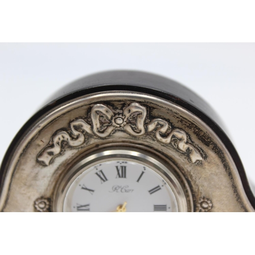 230 - An R. Carr hallmarked .925 silver fronted small mantle/bedside clock