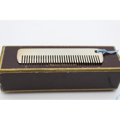 231 - A boxed stamped .925 sterling silver Penhaligon's plain comb with blue tassel - approx. gross weight... 