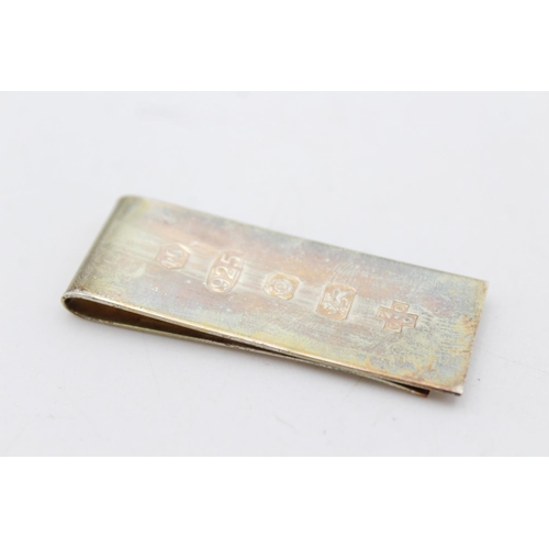 251 - An R. Carr hallmarked .925 sterling silver Millennium money clip - approx. gross weight 14 grams and... 