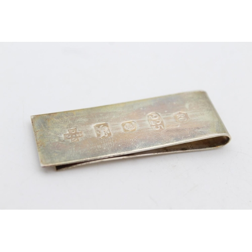 251 - An R. Carr hallmarked .925 sterling silver Millennium money clip - approx. gross weight 14 grams and... 