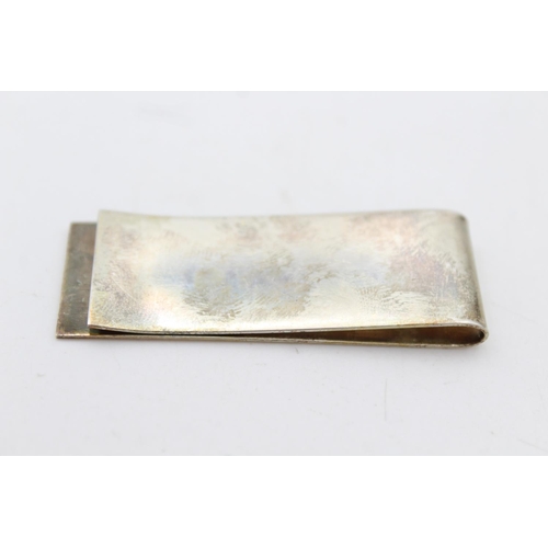 251 - An R. Carr hallmarked .925 sterling silver Millennium money clip - approx. gross weight 14 grams and... 