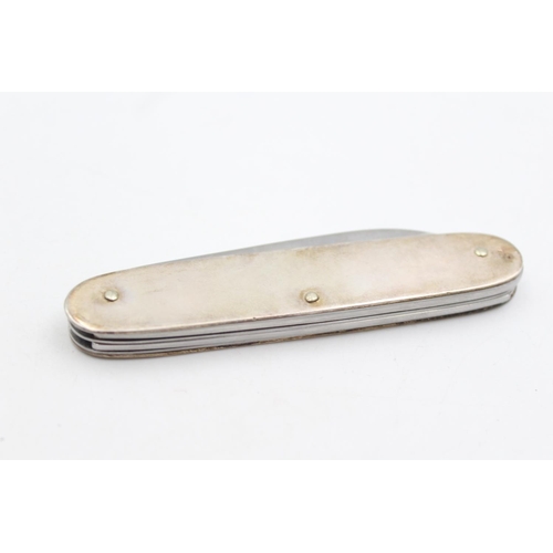 221 - A vintage hallmarked Sheffield sterling multi-tool pocket knife, dated 1998 - approx. gross weight 8... 