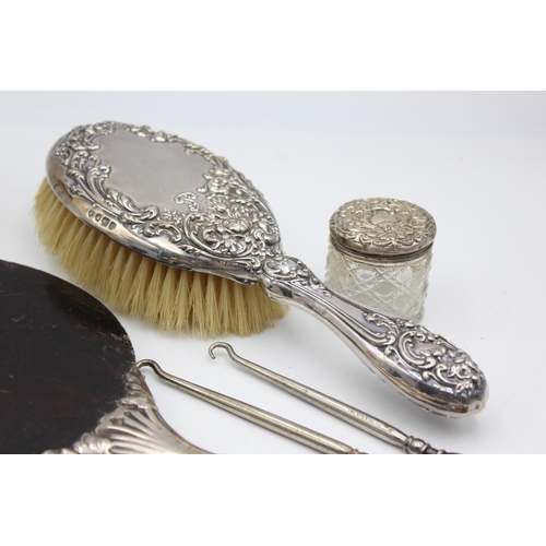 223 - Eight antique hallmarked .925 sterling silver ladies vanity items to include brushes, handled tools,... 