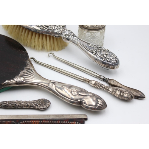 223 - Eight antique hallmarked .925 sterling silver ladies vanity items to include brushes, handled tools,... 