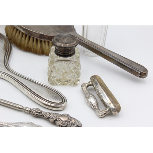 225 - Eight antique hallmarked .925 sterling silver ladies vanity items to include brushes, handled tools,... 