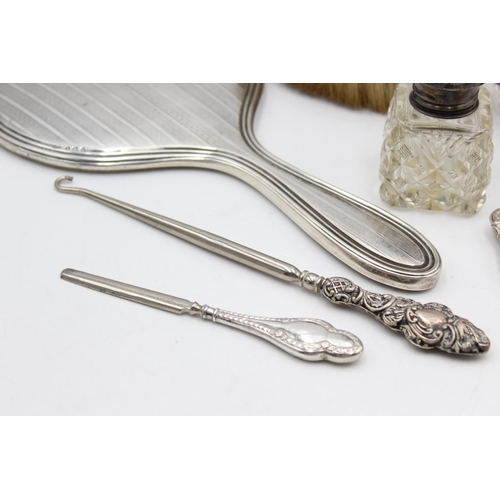 225 - Eight antique hallmarked .925 sterling silver ladies vanity items to include brushes, handled tools,... 