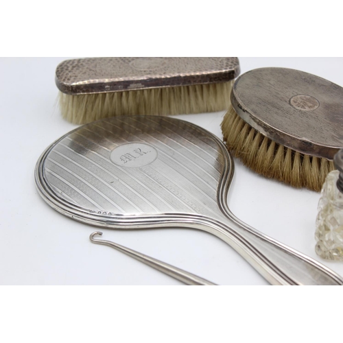 225 - Eight antique hallmarked .925 sterling silver ladies vanity items to include brushes, handled tools,... 