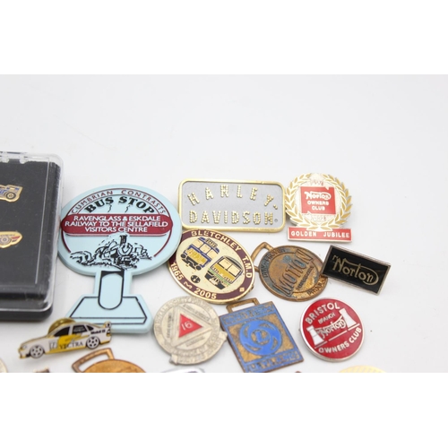 63 - A collection of assorted transport pin badges and fobs