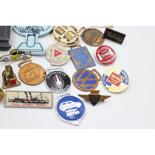 63 - A collection of assorted transport pin badges and fobs