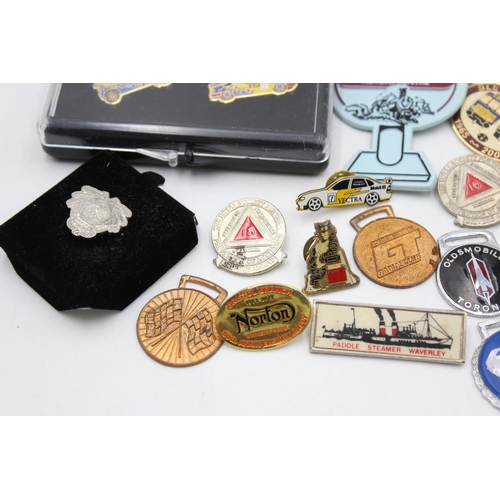 63 - A collection of assorted transport pin badges and fobs