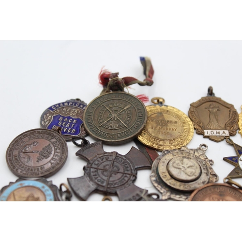 64 - A collection of antique fobs/medallions