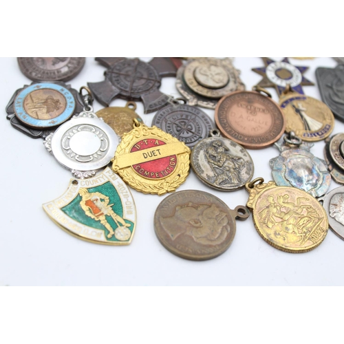 64 - A collection of antique fobs/medallions