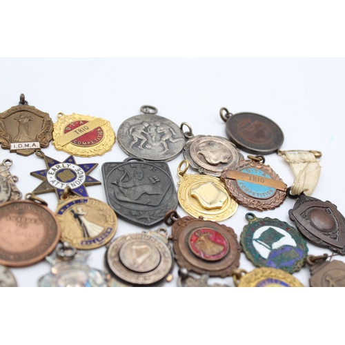 64 - A collection of antique fobs/medallions