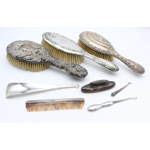 1362 - Eight antique hallmarked .925 sterling silver women's vanity items to include brushes, handled tools... 