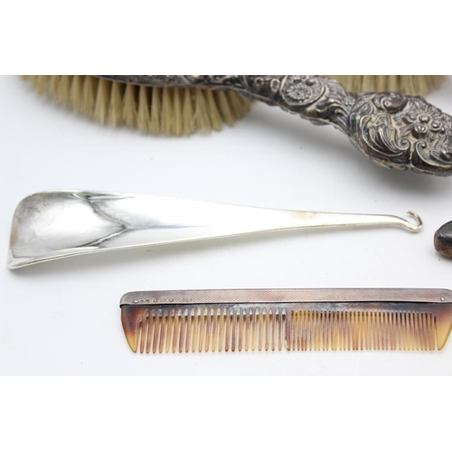 1362 - Eight antique hallmarked .925 sterling silver women's vanity items to include brushes, handled tools... 