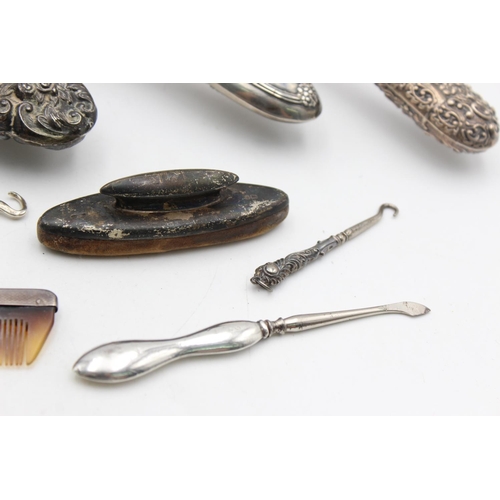 1362 - Eight antique hallmarked .925 sterling silver women's vanity items to include brushes, handled tools... 