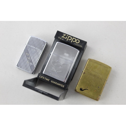 1374 - Three assorted Zippo cigarette lighters