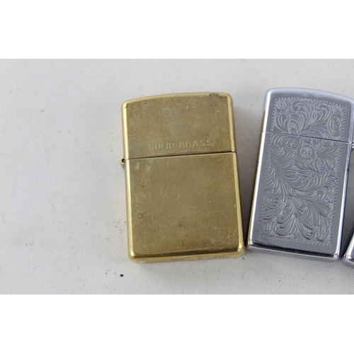 1375 - Three assorted Zippo cigarette lighters