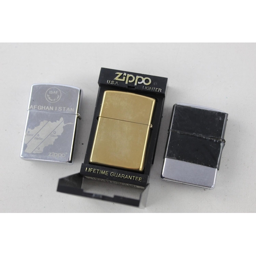 1376 - Three assorted Zippo cigarette lighters