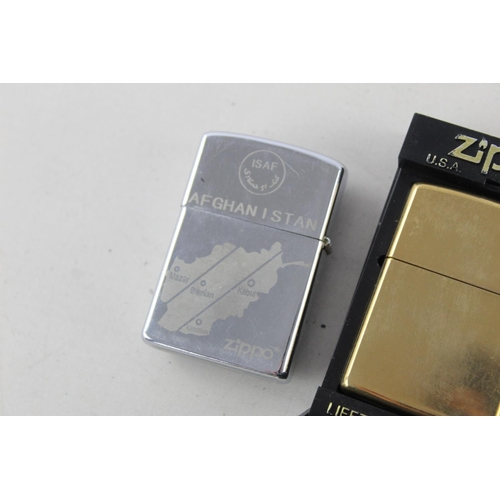 1376 - Three assorted Zippo cigarette lighters