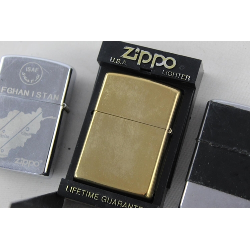 1376 - Three assorted Zippo cigarette lighters