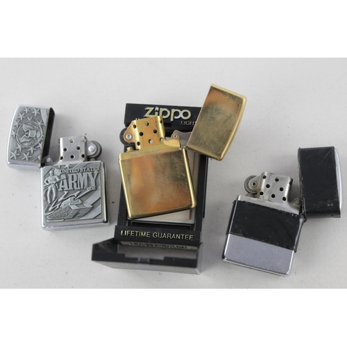 1376 - Three assorted Zippo cigarette lighters