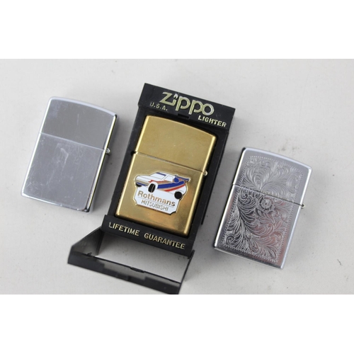 1380 - Three assorted Zippo cigarette lighters