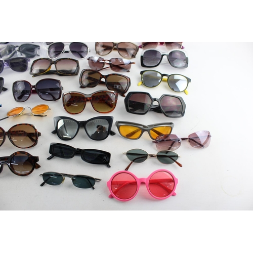 173 - A large collection of assorted sunglasses to include Miss Sixty, Thomas James, Slazenger etc.