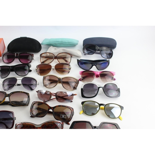 173 - A large collection of assorted sunglasses to include Miss Sixty, Thomas James, Slazenger etc.