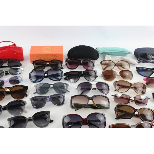 173 - A large collection of assorted sunglasses to include Miss Sixty, Thomas James, Slazenger etc.