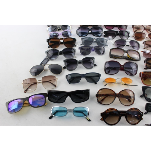 173 - A large collection of assorted sunglasses to include Miss Sixty, Thomas James, Slazenger etc.