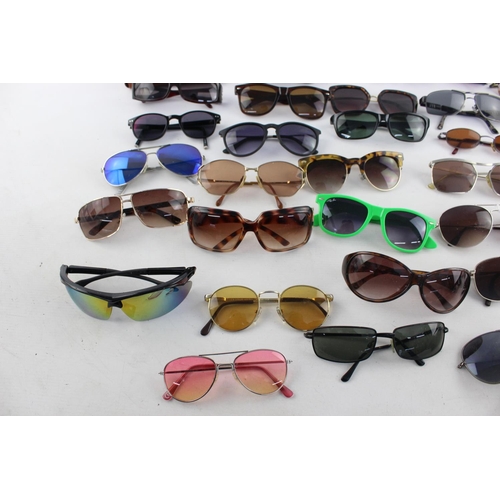 177 - A large collection of assorted sunglasses to include Ted Baker, Pilgrim, Lee Cooper etc.