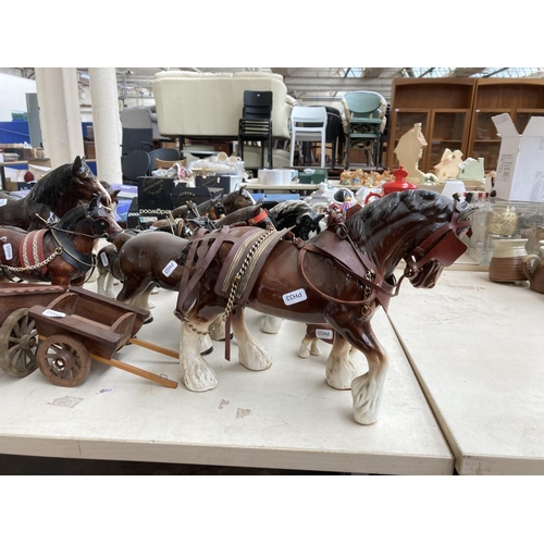 103A - A large collection of ceramic shire horse figurines