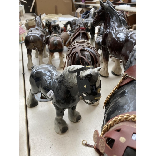 103A - A large collection of ceramic shire horse figurines