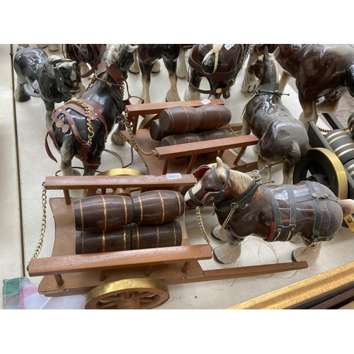 103A - A large collection of ceramic shire horse figurines