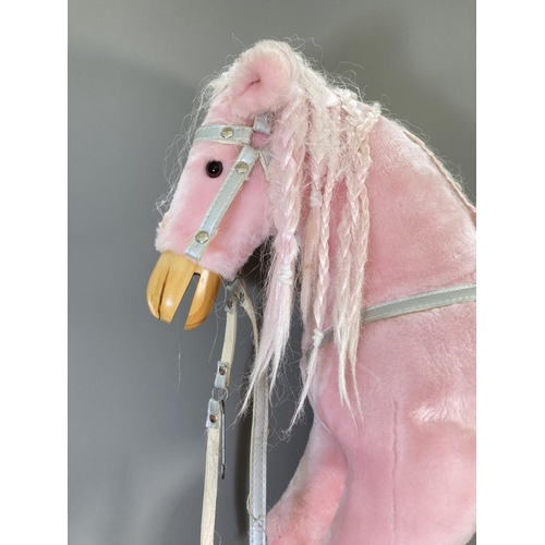 142 - A modern pink rocking horse with grey painted wooden base - approx. 85cm high x 39cm wide x 103cm lo... 