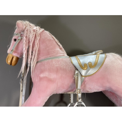 142 - A modern pink rocking horse with grey painted wooden base - approx. 85cm high x 39cm wide x 103cm lo... 