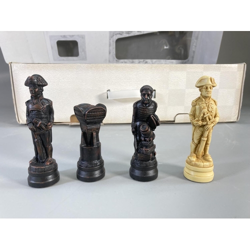 143 - A boxed Sac The Traditional Games Company Limited sculpted chess set with wooden veneer folding ches... 