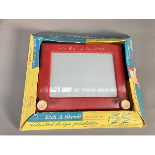 160 - A collection of boxed vintage games to include Etch-A-Sketch, Julie and Her Mother Magic Wand Dressi... 