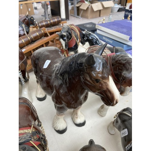 103A - A large collection of ceramic shire horse figurines