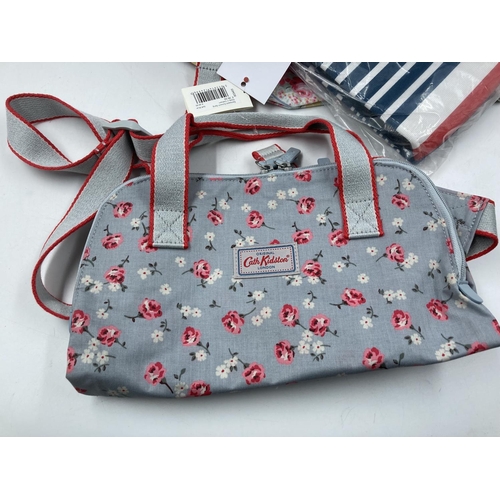 171 - Seven various women's fashion accessories to include Radley London canvas bag, pashminas, John Lewis... 