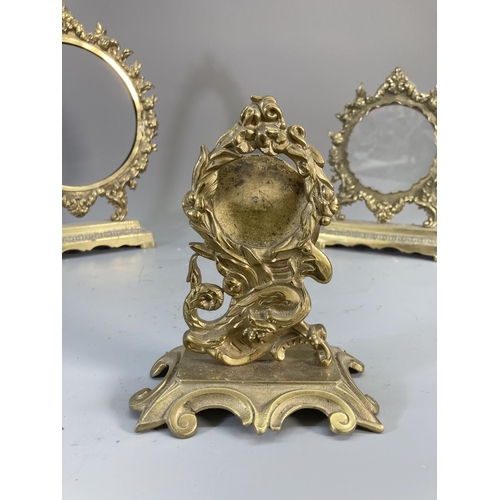 127 - Three Rococo style brass picture frames - largest approx. 29cm high