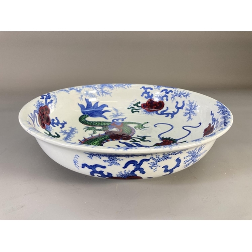 66 - A 1920s Bursley Ware Dragon pattern circular bowl - approx. 31cm diameter